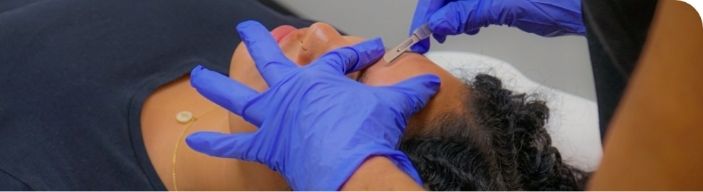 Girl getting hair removed from skin